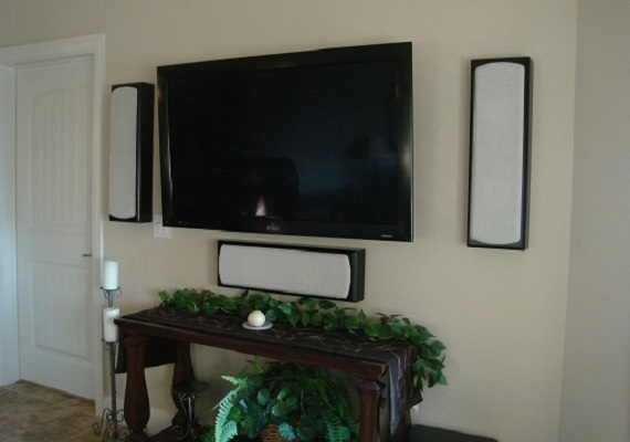 Living room surround sound on-wall.